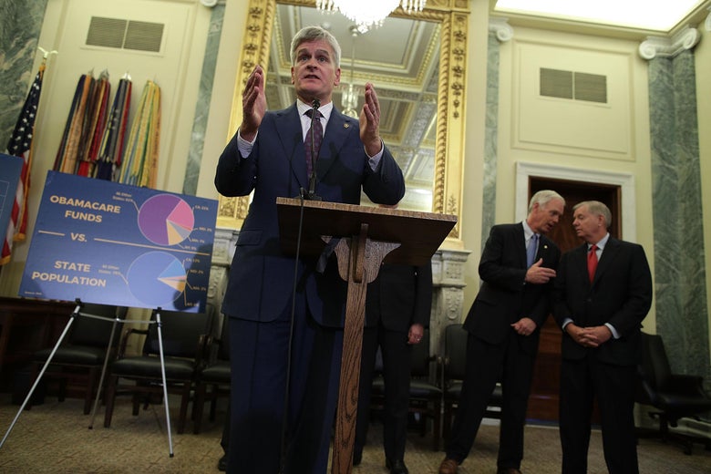 Sen. Bill Cassidy speaks as Sens. Ron Johnson and Lindsey Graham talk to each other during a news conference on health care Sept. 13 on Capitol Hill in Washington.